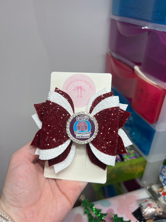 The molly bow school logo bow