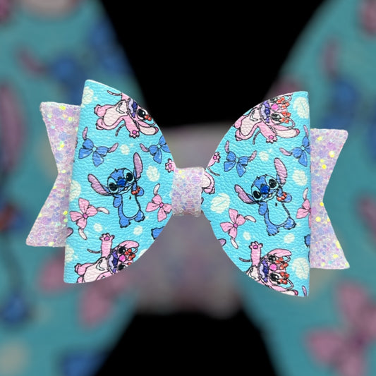 Blue and pink monster hair bow